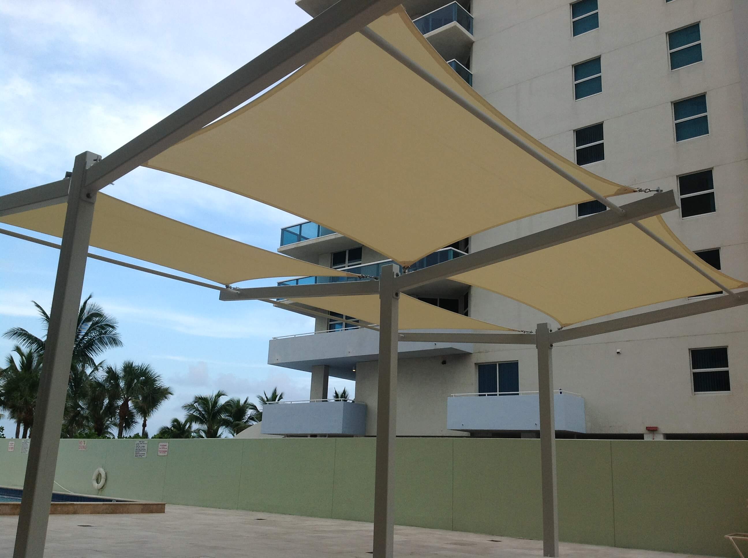 Four_Winds_Condo_Poolside_tension_shade_sails | Shade FLA